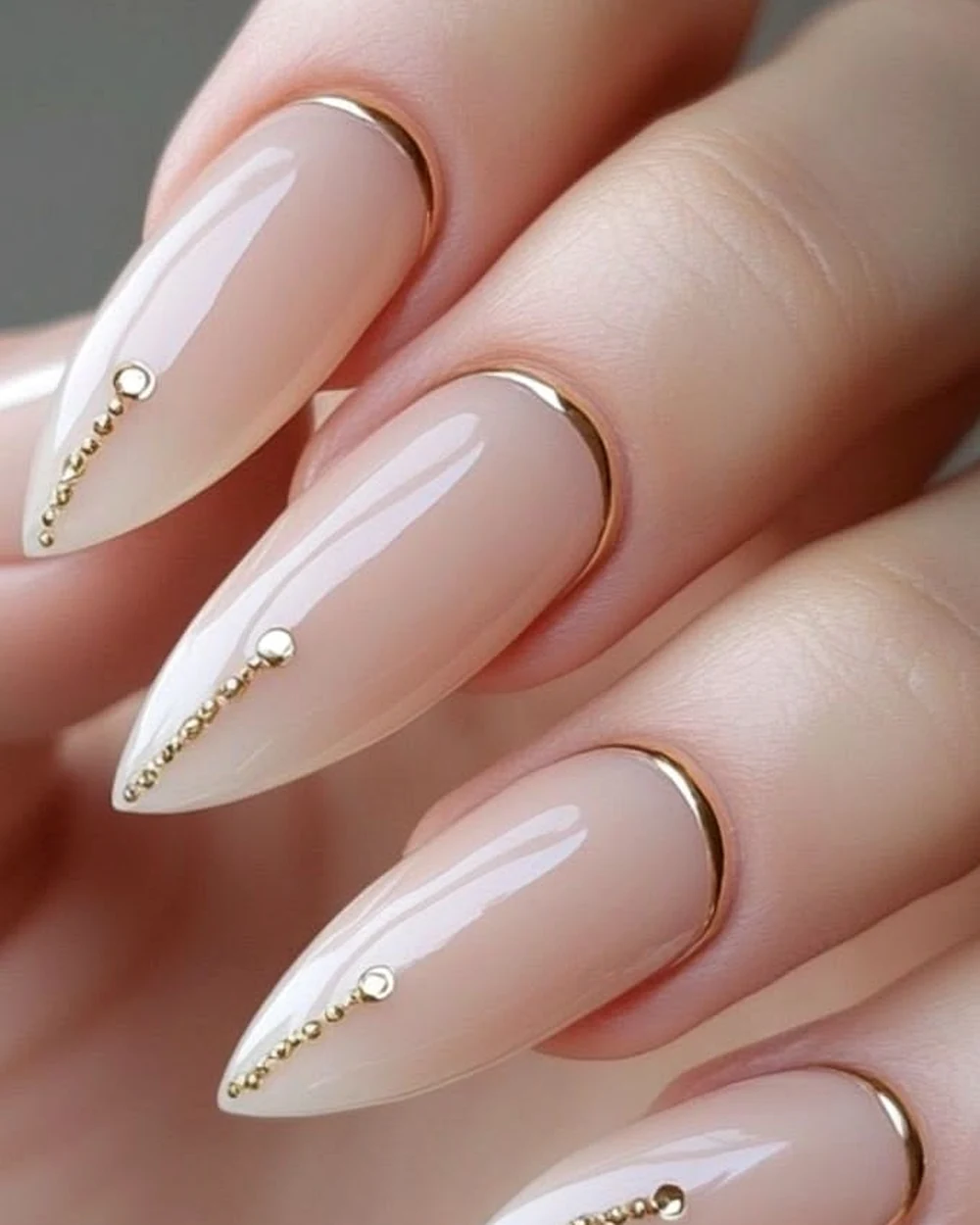 Nude nail design with gold details
